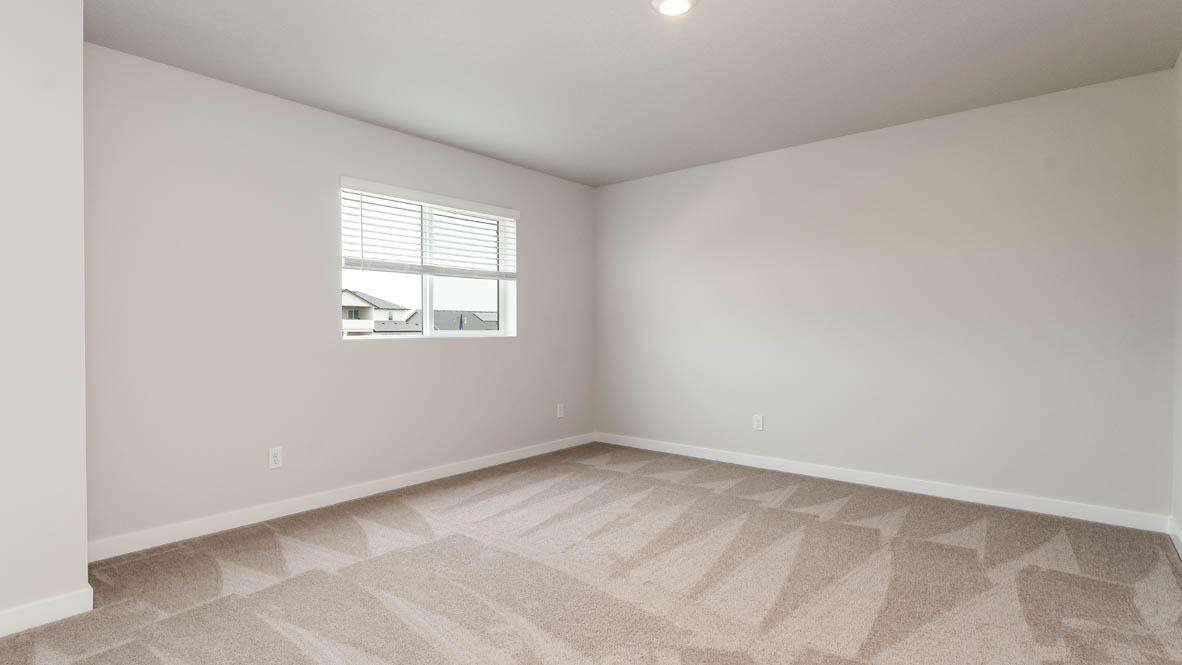 Sorrento Estates bedroom with carpeting and white walls
