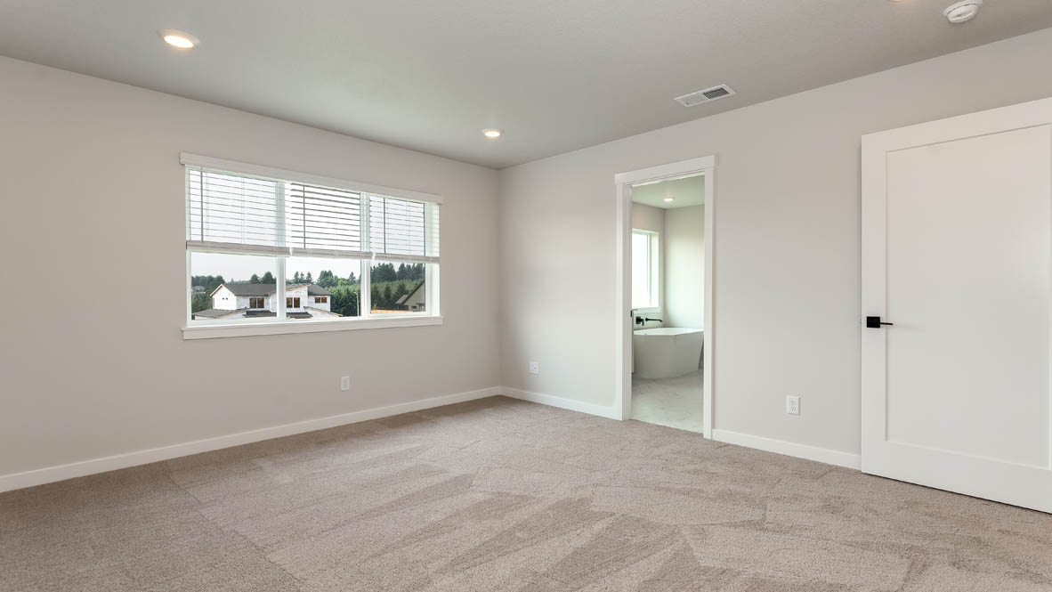 Sorrento Estates primary bedroom with en suite bathroom and walk in closet