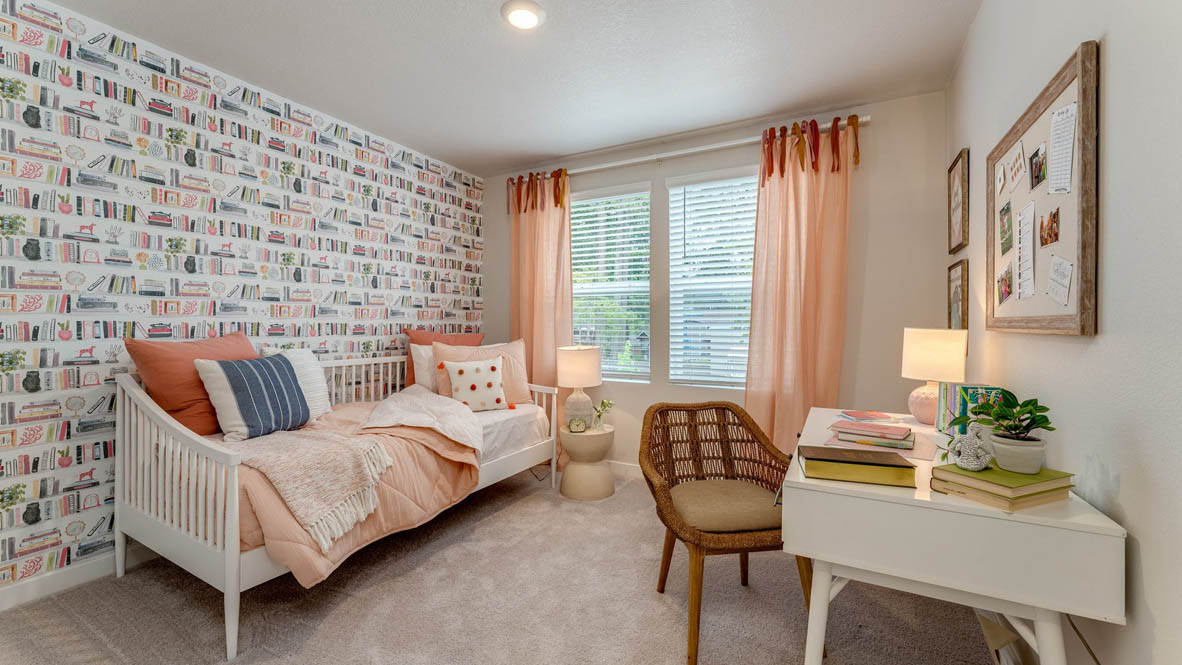 Sorrento Estates Bedroom with pink theme, bedding and window drapes, light wood furniture, and carpeting