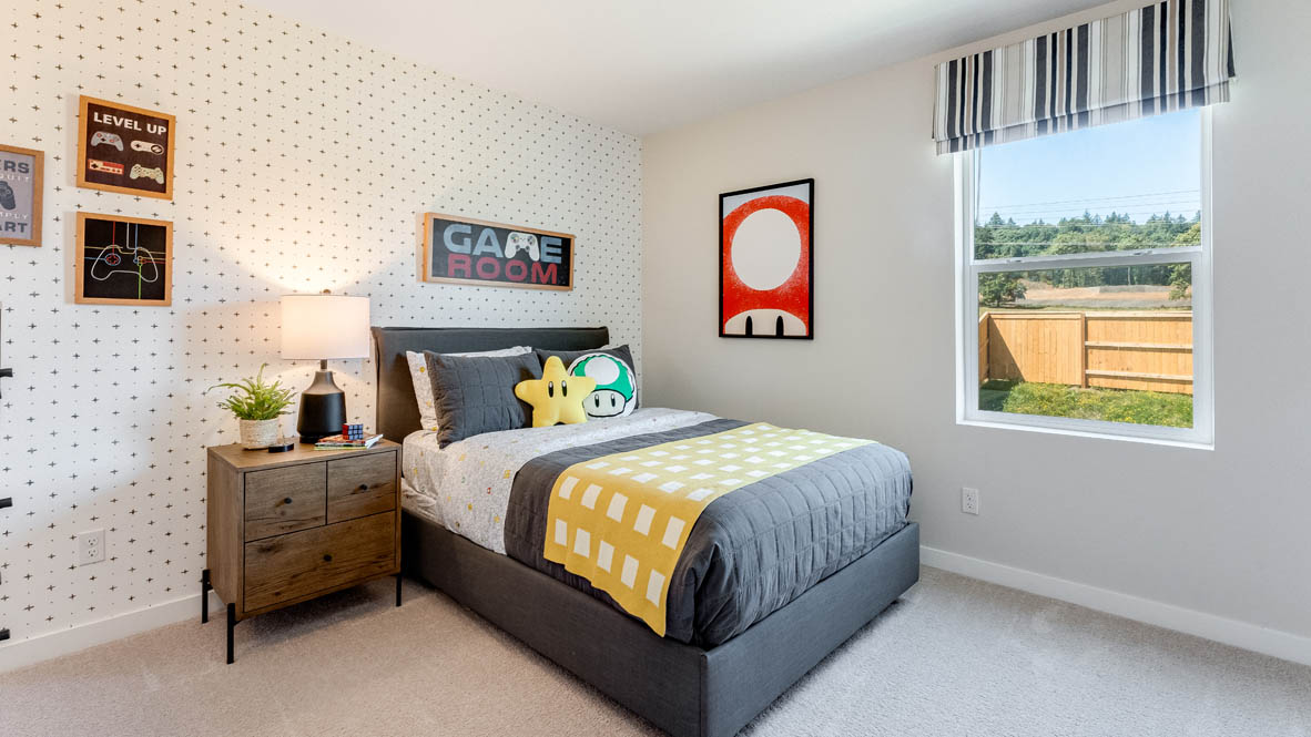 Sorrento Estates Video game themed bedroom with a twin sized bed and carpeting