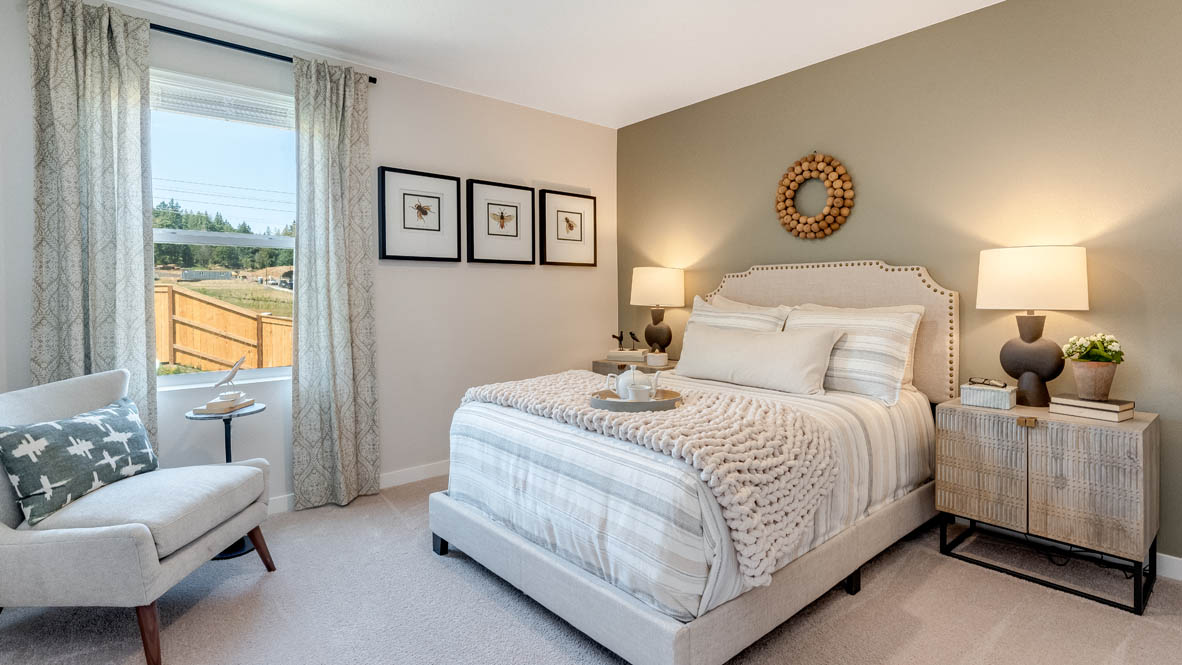 Sorrento Estates Bedroom with gray accent wall and full/queen size bed