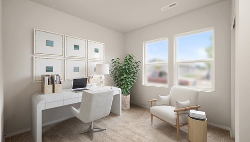 A room with a white desk and white chair, there are 6 picture frames hanging in front of the desk and a large plant to the right, there's a white accent chair, and two large windows letting in natural light.