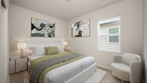 A bedroom with a bed with white and green sheets, two bedside tables with lamps, two abstract paintings hung on the walls, a white accent chair in the right corner, and one large window letting in natural light.