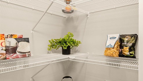A pantry with wire shelving.