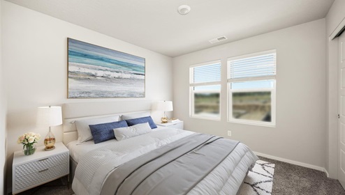 A bedroom with a bed with white and grey sheets, two bedside tables with lamps, an abstract painting hanging above the bed, and two large windows letting in natural light.