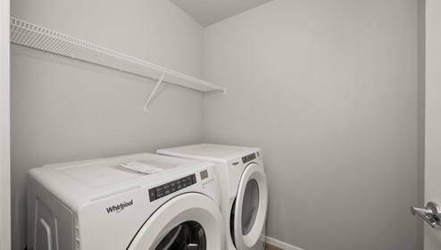 A laundry room with a washer and dryer.