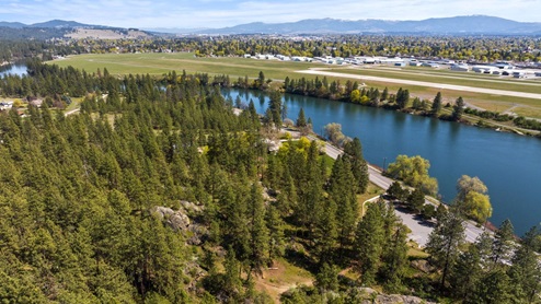 An aerial view of the nearby forest and Spokane River.