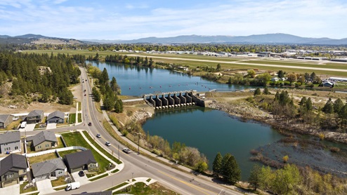 An aerial view of the nearby forest and Spokane River.