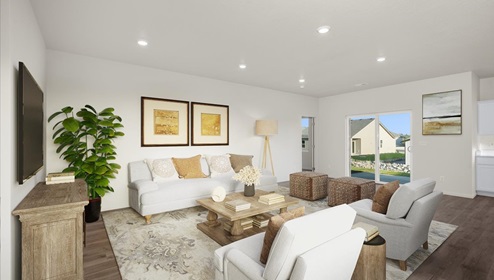 A living area with a light rug, white couch and accent chairs, and a wood coffee table.