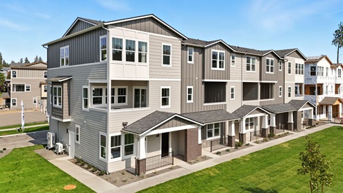 A photo of the exterior of the Grand Mill townhomes.