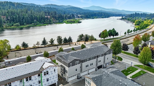 A drone shot of the Spokane River across the street from Grand Mill Townhomes