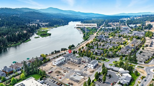 A drone shot of the community's private park alongside the Spokane river.