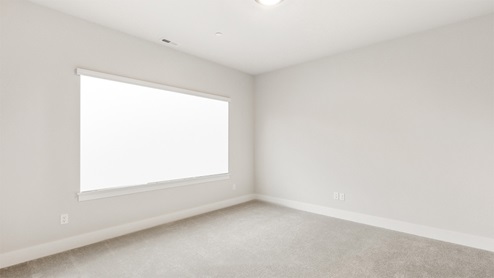 Secondary bedroom suite on main floor of Windom plan built at Remington East