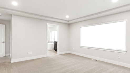 Windom plan primary bedroom suite with access to private bath