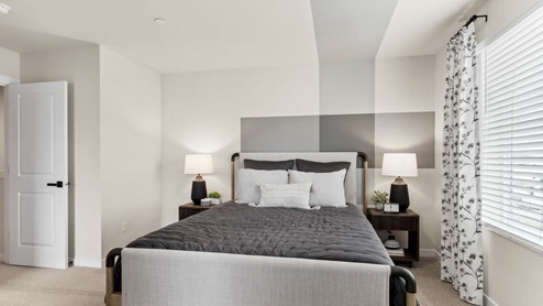 Bedroom suite with large window with private bath and walk-in closet