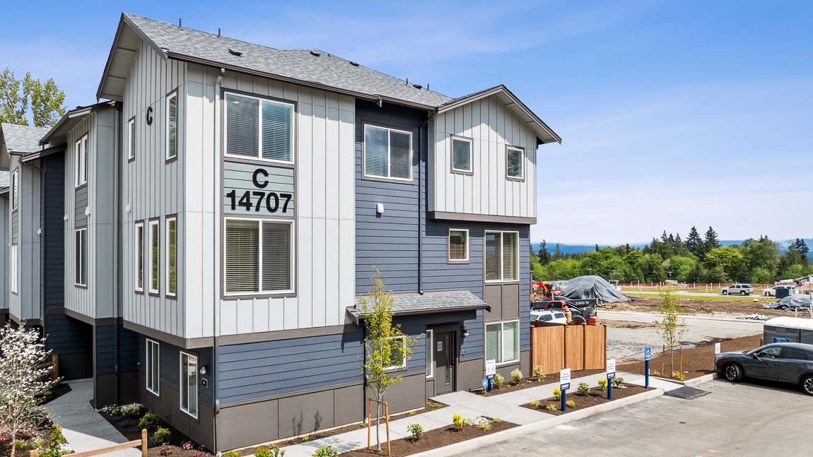 A side view of Model home building at Cathcart Crossing