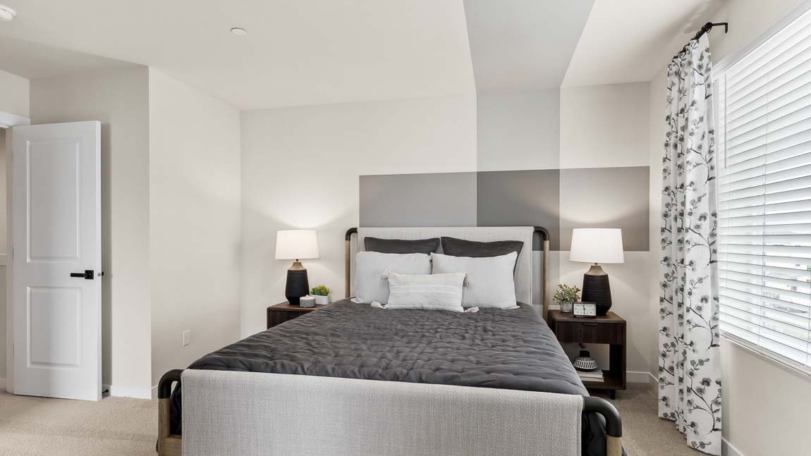 Private bedroom suite showcased in the Addison model home at Cathcart Crossing