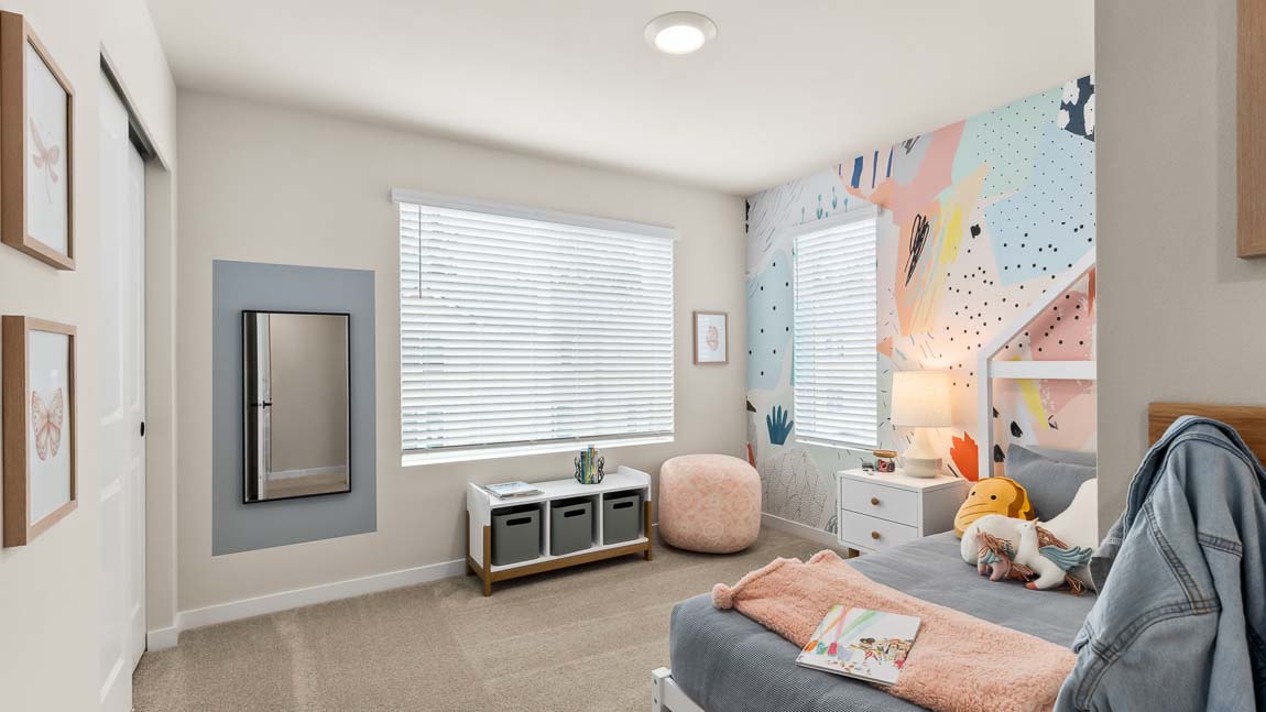 Addison model home features a secondary bedroom that includes two bright windows and storage closet