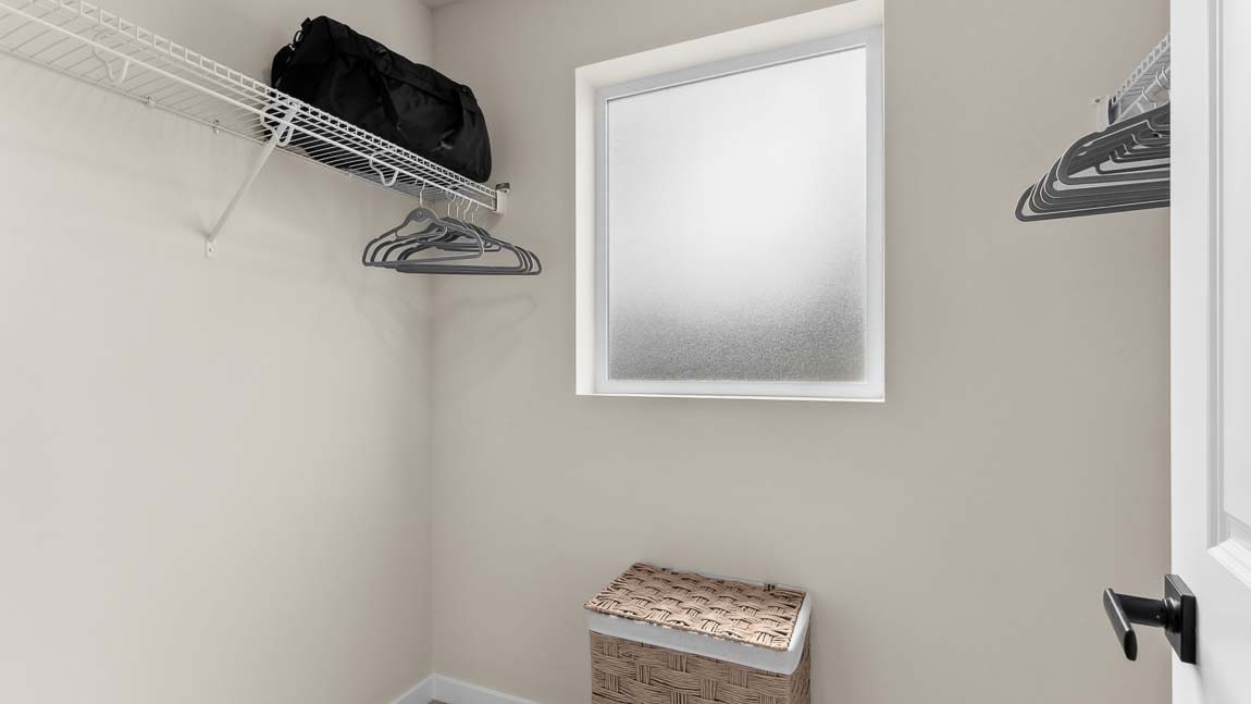 Private bedroom suite provides a walk-in closet with bright window for additional light