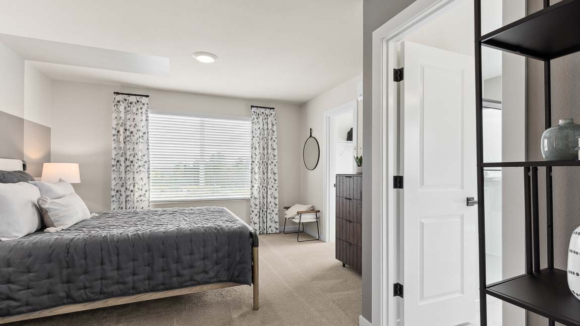 Stacking washer and dryer inside the laundry closet in the Addison model home at Cathcart Crossing