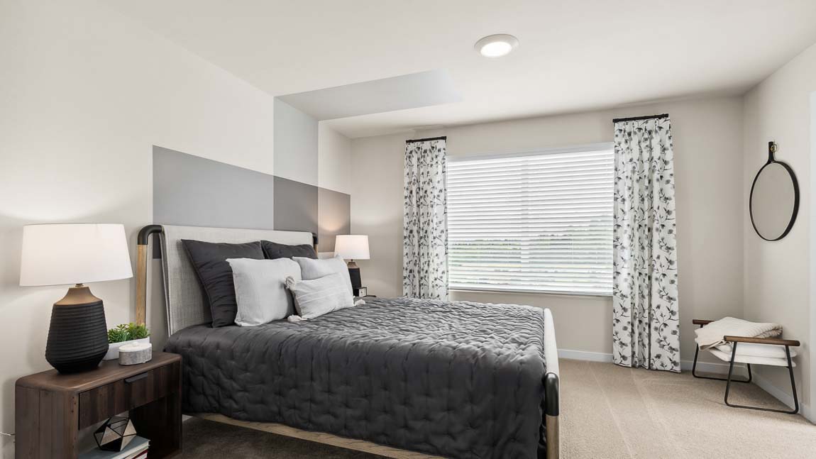 Spacious bedroom suite with bright window