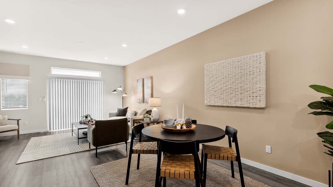 Bennett main floor dining room and living room with sliding glass door access to balcony