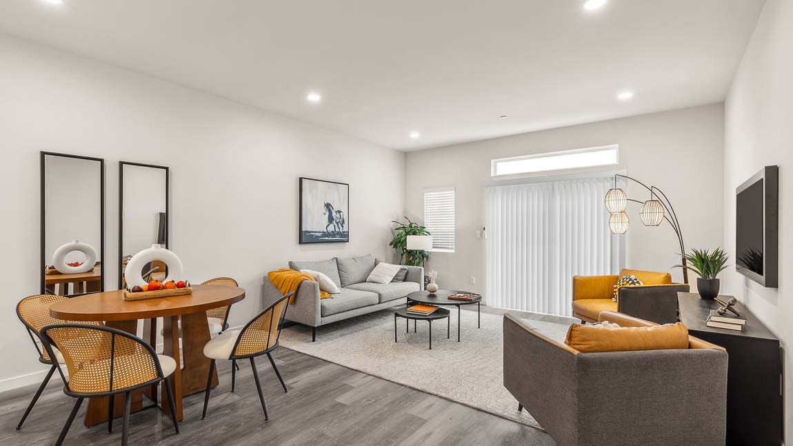 Capri model home living and dining rooms with bright corner window