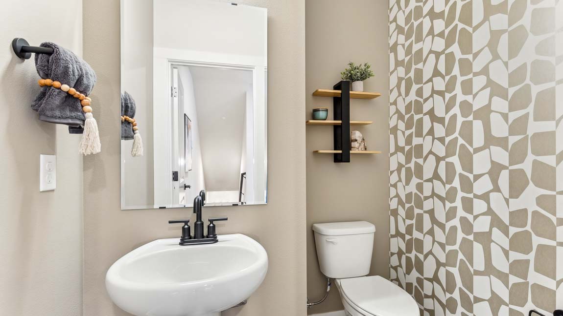 Powder room in Addison ﬂoor plan with pedestal sink
