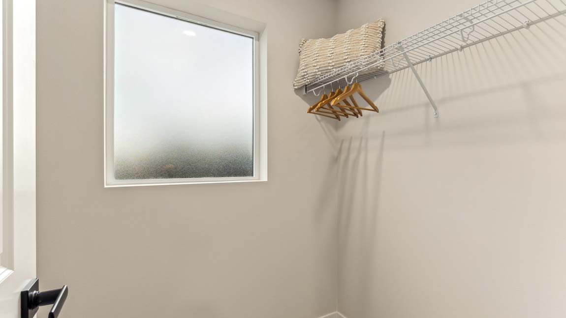 Generously sized walk-in closet in primary bedroom