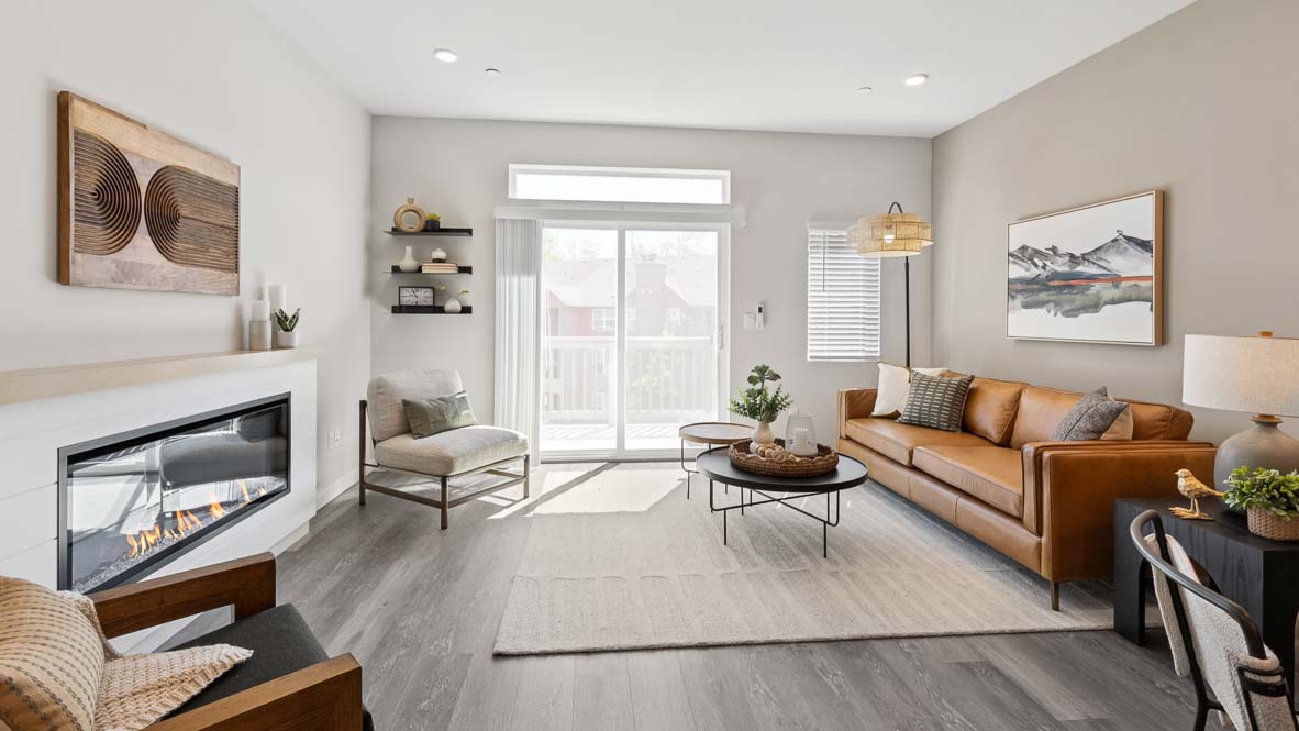 Beautiful Living room bathed in natural light and featuring modern electric fireplace
