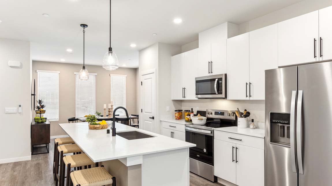 Kitchen in Addison ﬂoor plan with quartz countertops and stainless-steel appliances