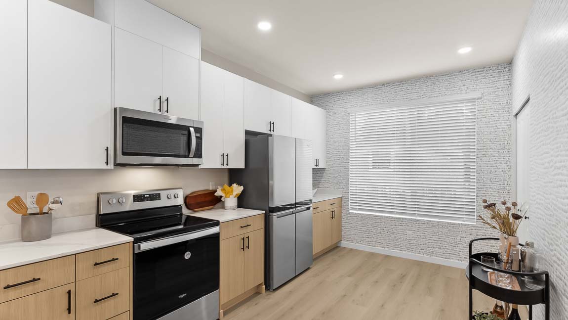 Huge window and pantry closet in spacious kitchen area