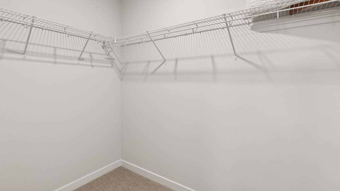 Spacious private walk-in closet in the primary suite