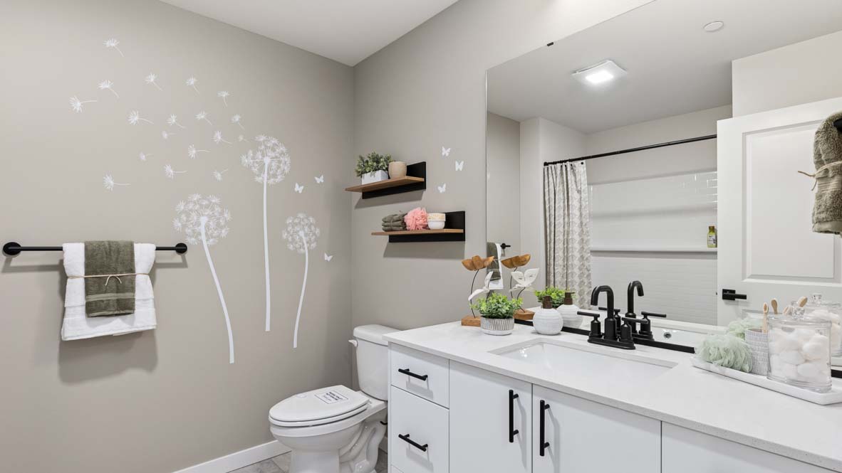 Capri model home upstairs hallway bathroom that provides quartz countertop vanity with undermount sink and tub-shower combo including a built-in shelf