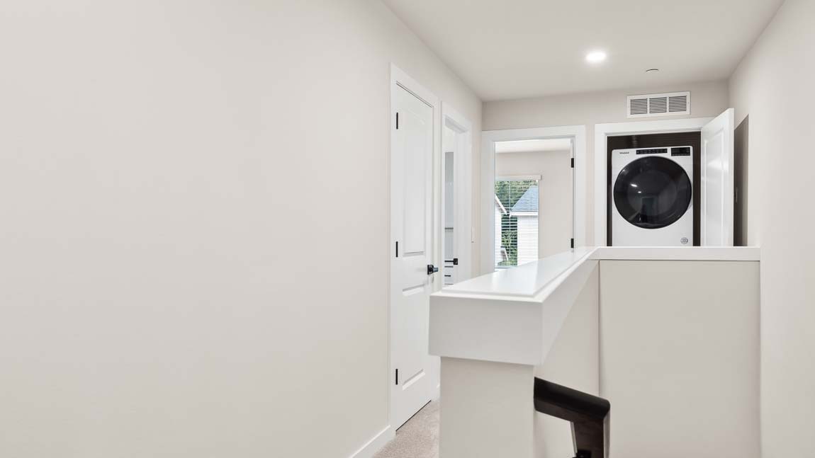 View of laundry closet Bed 2 hall bath and closet at top of stairway on upper floor