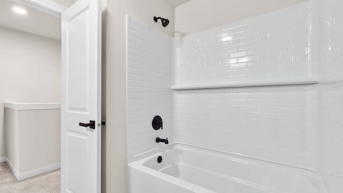 Built-in shower tub combo in hall bath