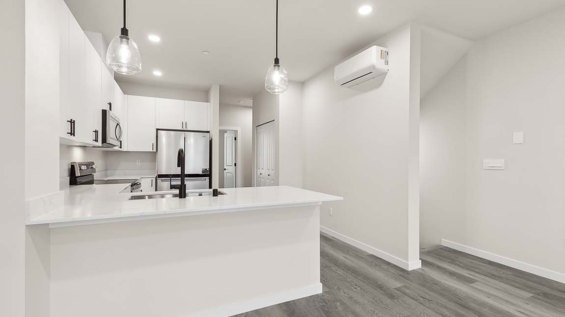 Kitchen with pantry and stairway access to lower floor