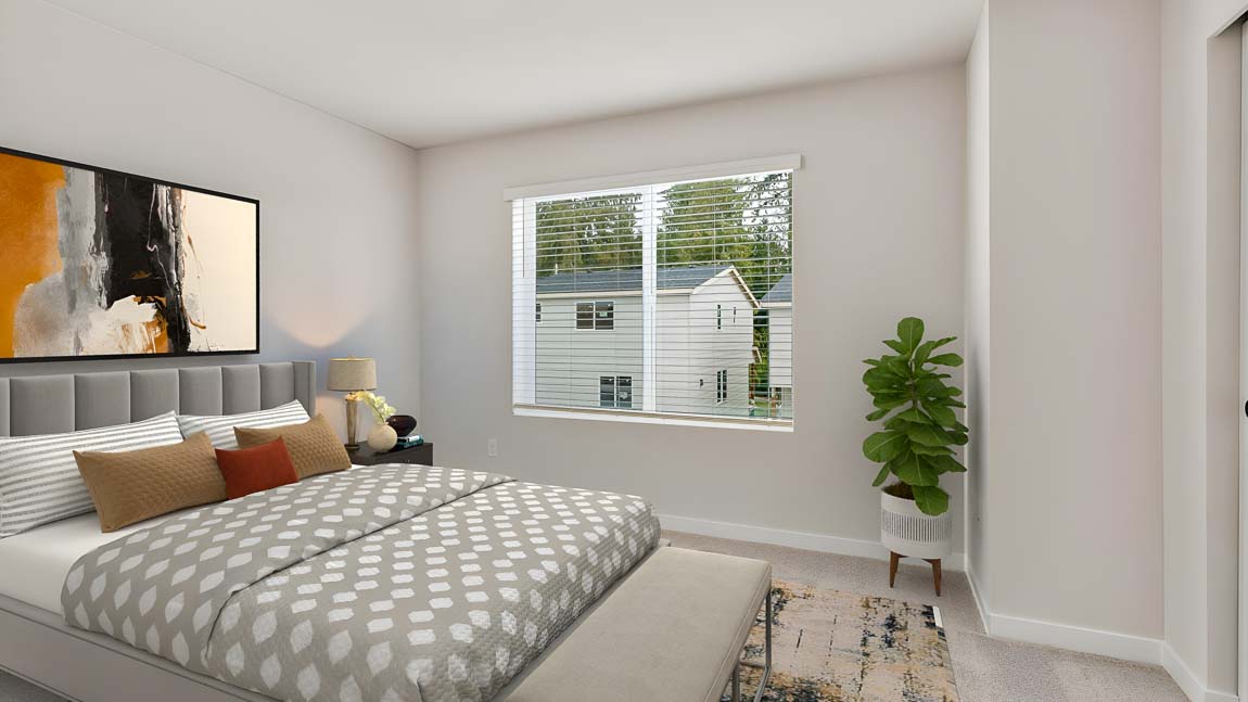 Secondary bedroom near laundry closet on upper floor