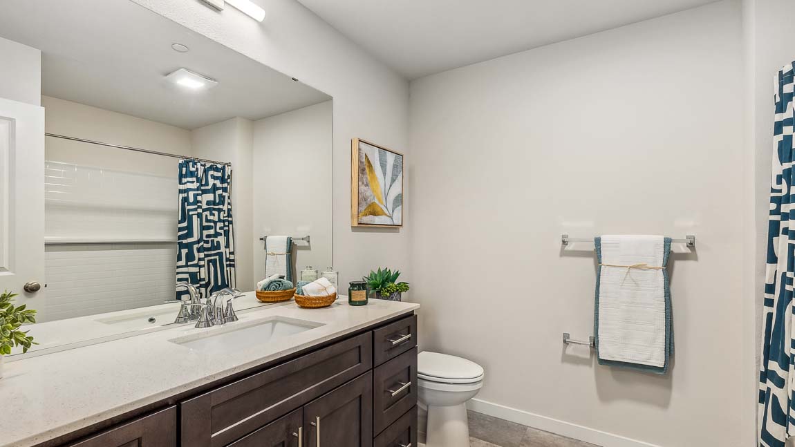 Upper floor hallway bathroom with shower tub combo