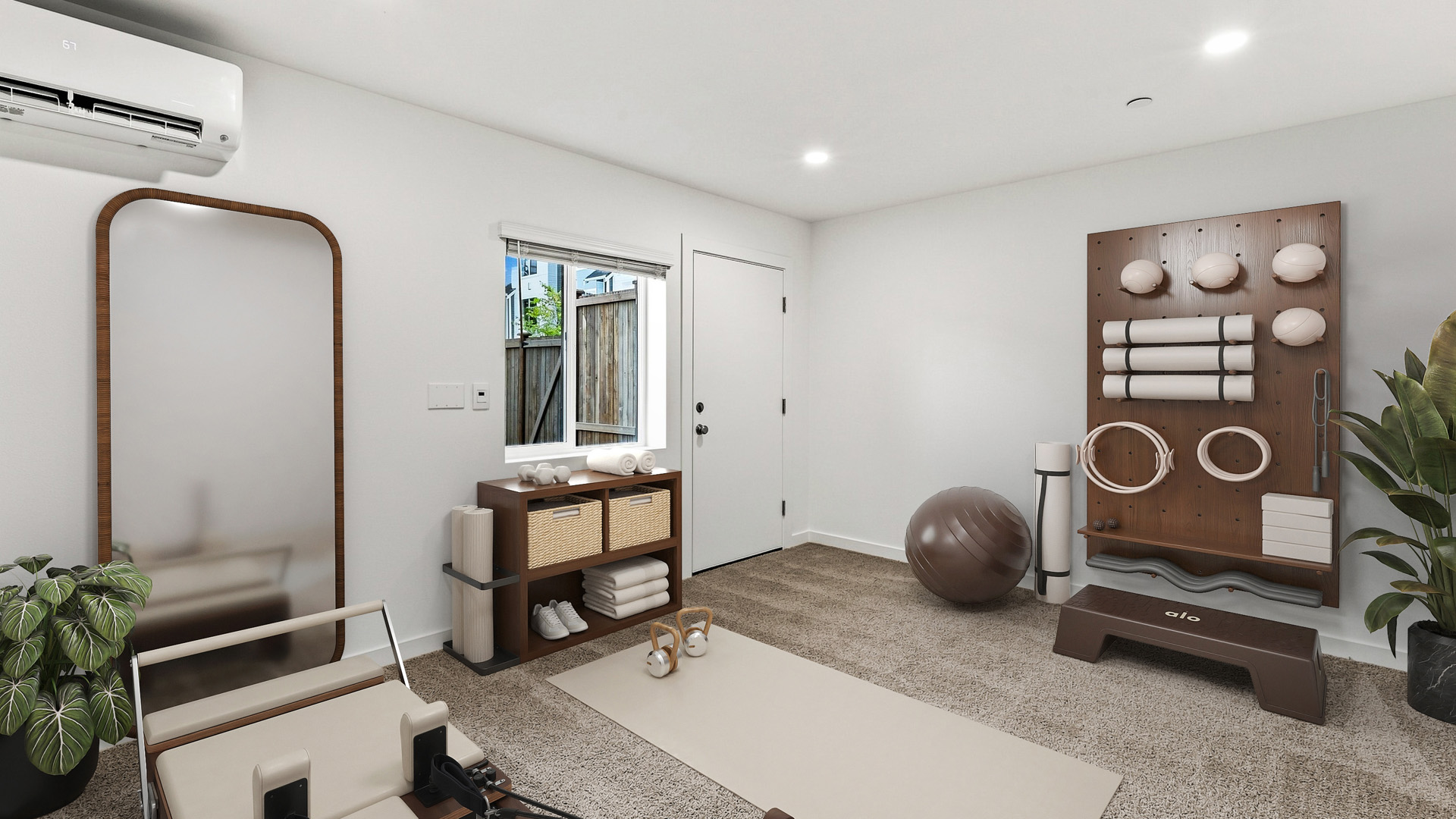 Flexible bonus room staged as a home fitness space with exercise mat, reformer machine, workout equipment, mirror, and storage shelving.