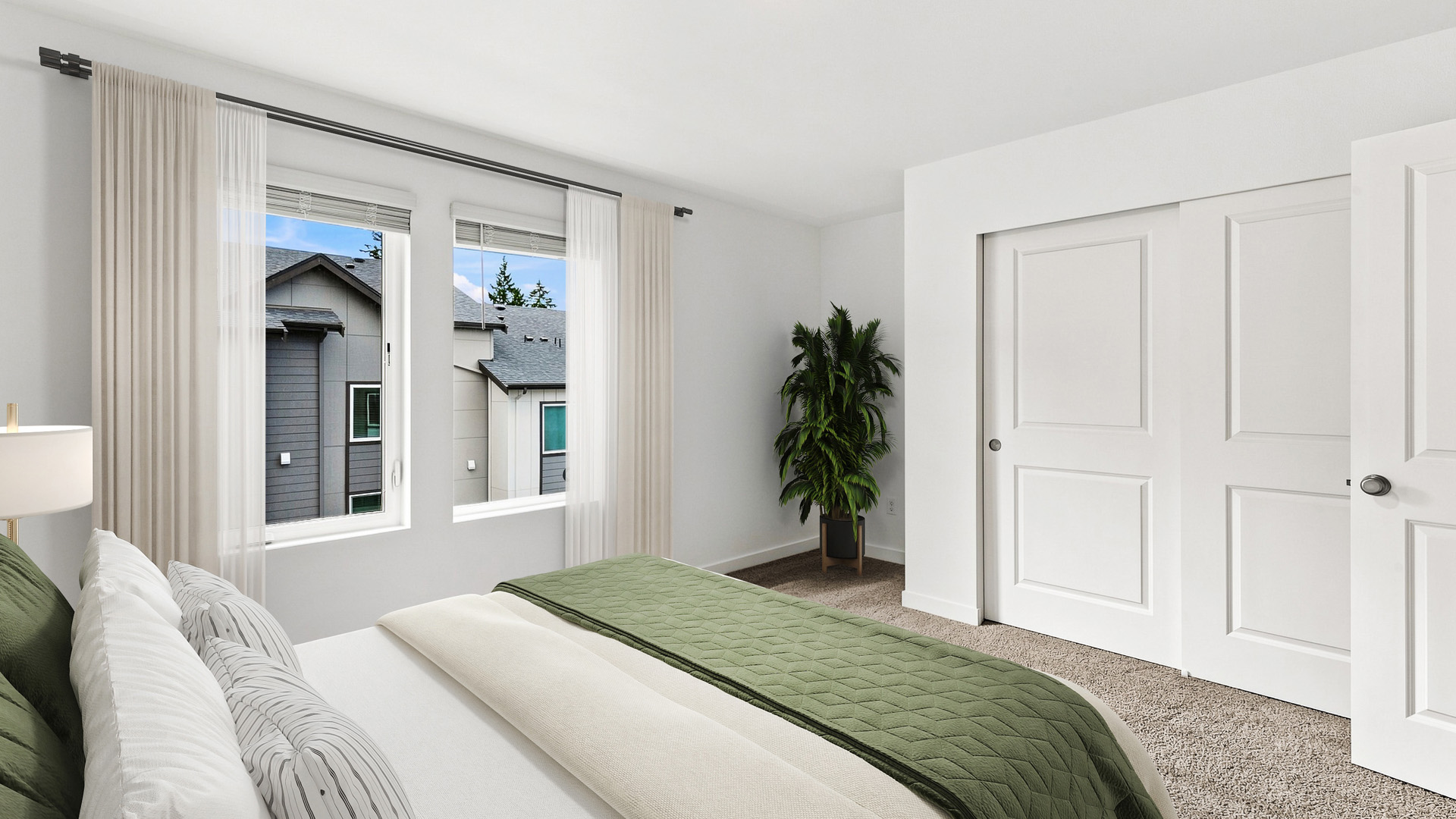 Secondary bedroom with large windows, sliding closet doors, carpeted flooring, and a bed dressed with green and white bedding.