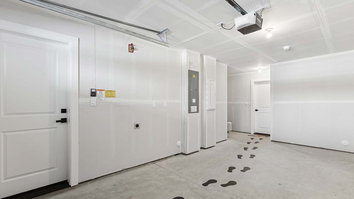 Convenient shared bathroom for lower-level flex-space offers modern finishes and step in shower