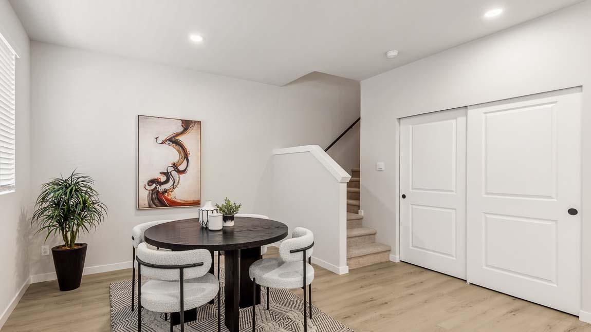 Dining space with access to the upper level and extra large storage closet