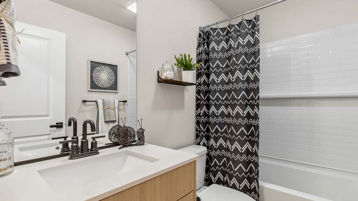 Hall bathroom upper level with shower tub combo