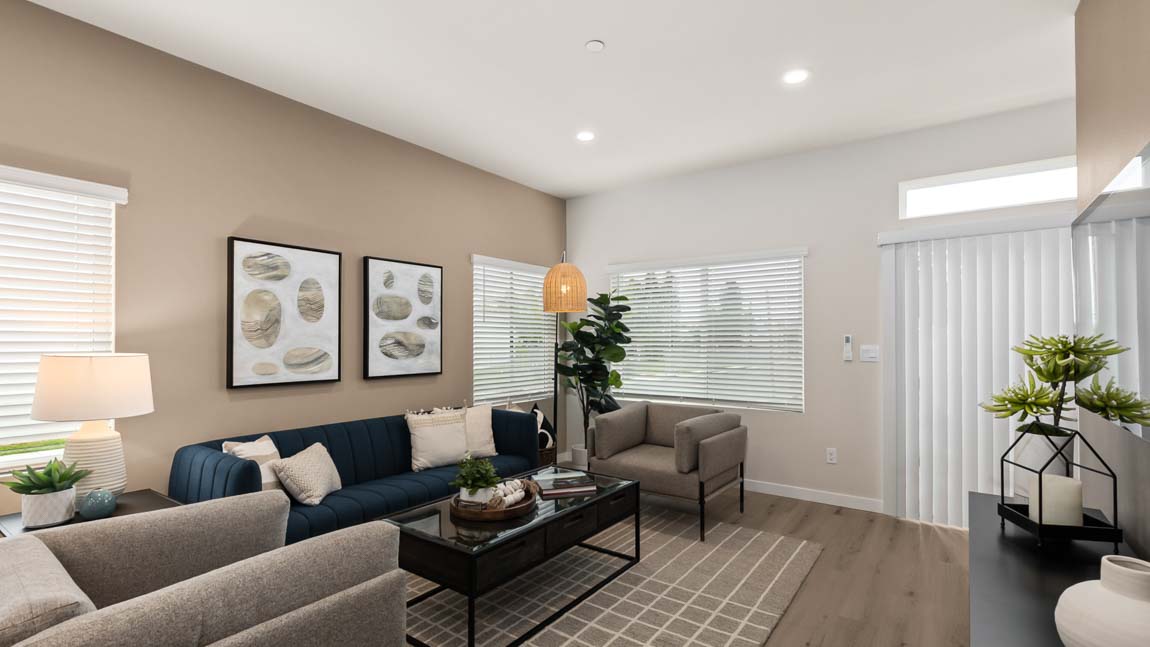 View of living room with lots of natural light and a access to a deck