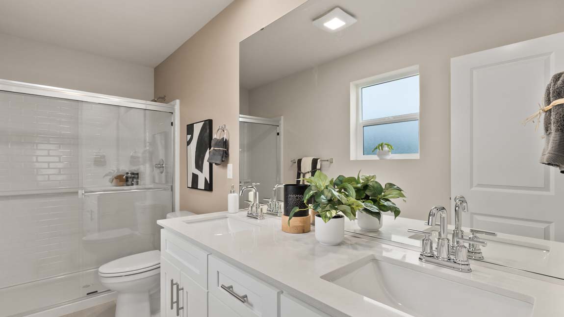 Primary bathroom with 2 sink vanity and extra large step in shower
