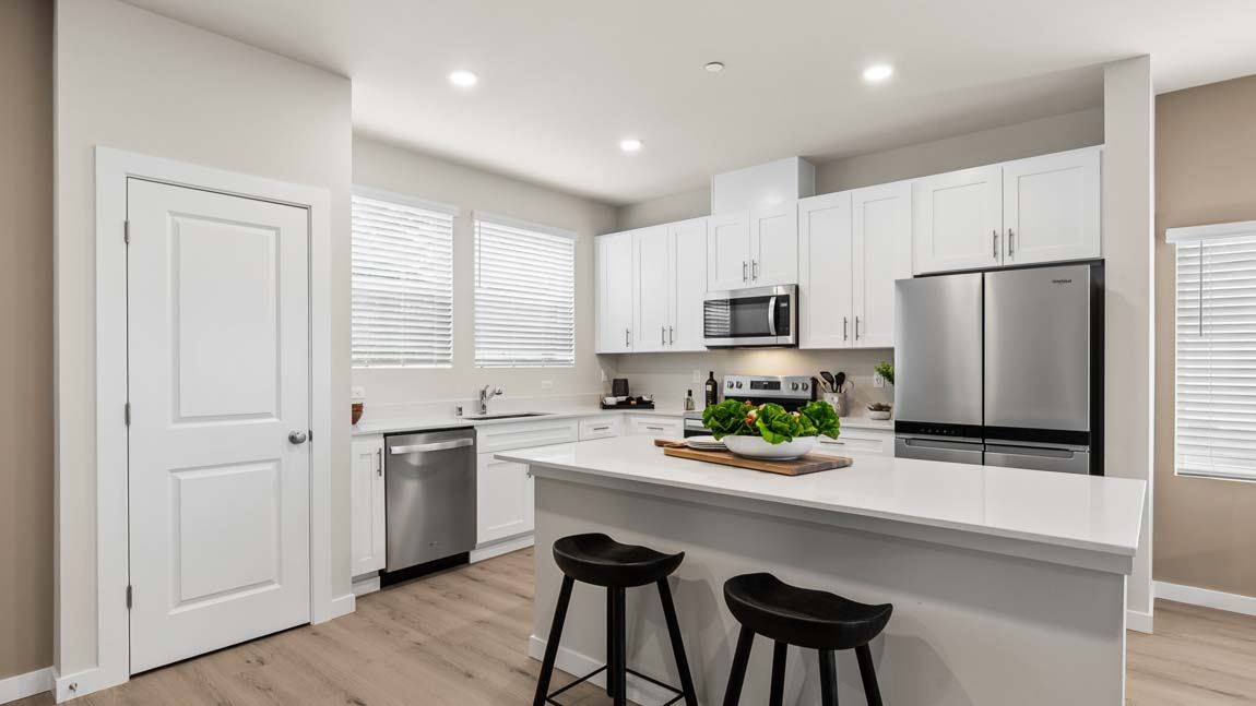View of spacious kitchen island providing extra storage and work surface