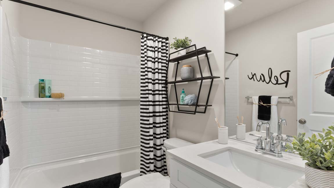 Hall bathroom upper level with shower tub combo