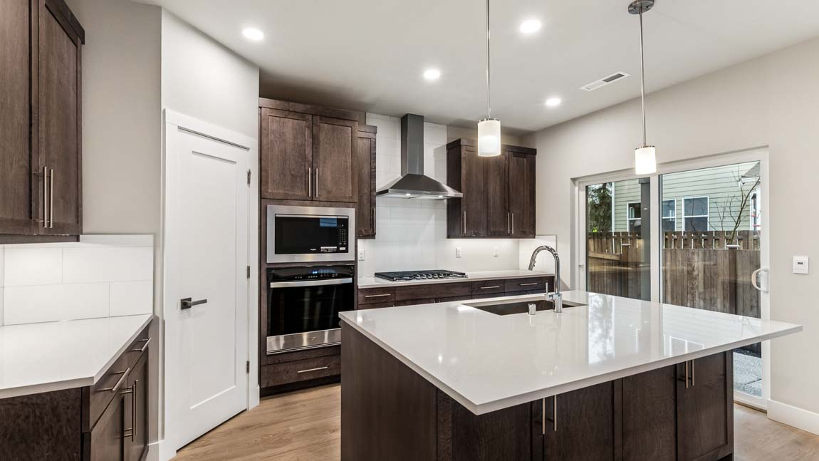 Large kitchen island with pendent lighting