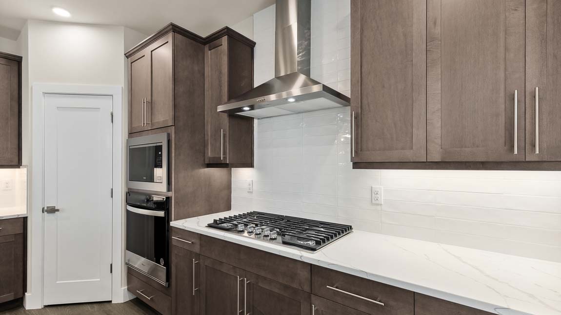Stainless steel appliances in this bright kitchen